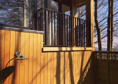 Vertical Juliette balcony on wooden building