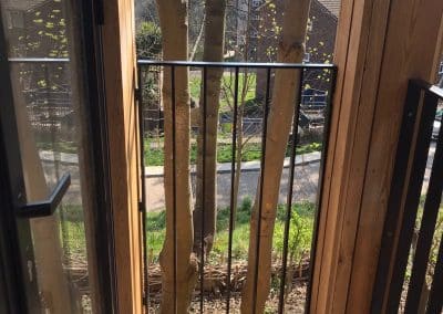 Modern metal balcony with wooden frame